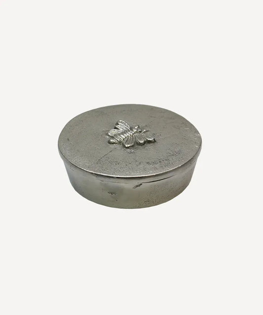 Round silver box with bee design